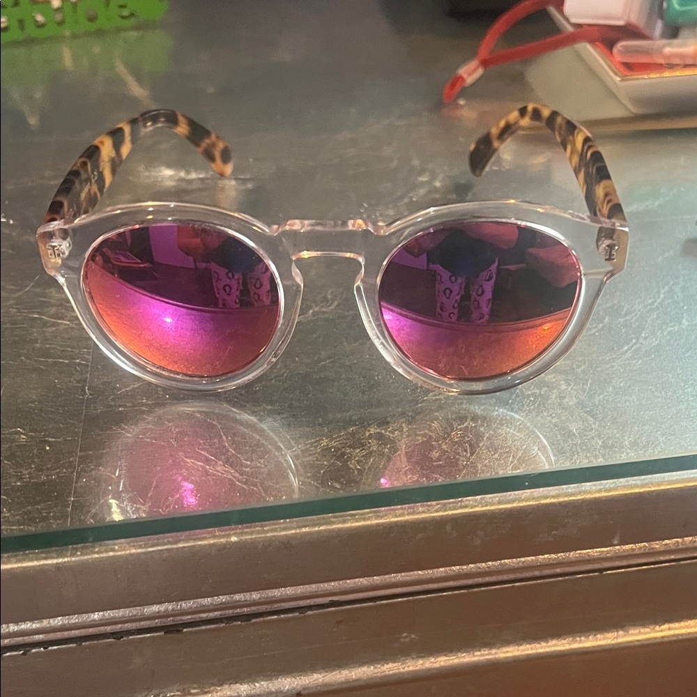 Illesteva Transparent Frame Sunglasses with pink tint mirrored lenses